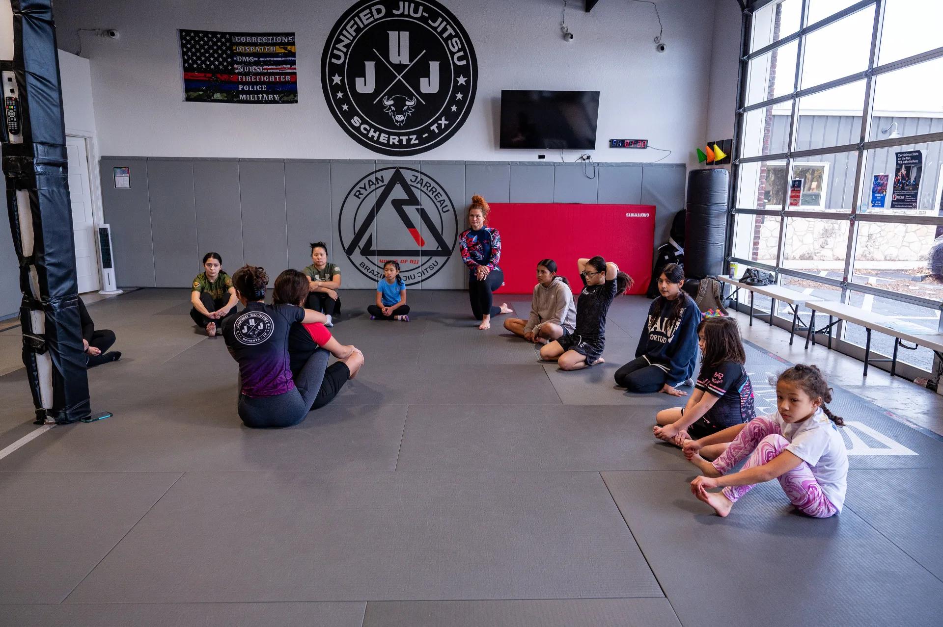 Homeschool jiu jitsu students in a structured class at Unified.